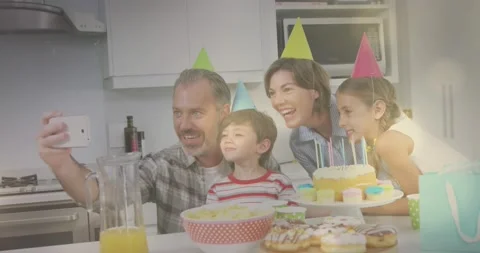 Composite video of spots of light against caucasian taking a selfie during a Stock Footage 173162998