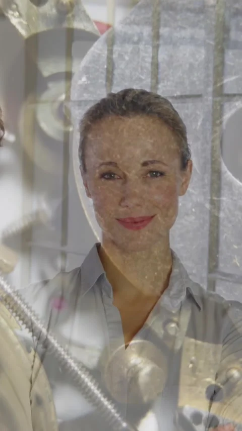 Composite video of three colleagues smiling at office against close up of clock Stock Footage 344803010