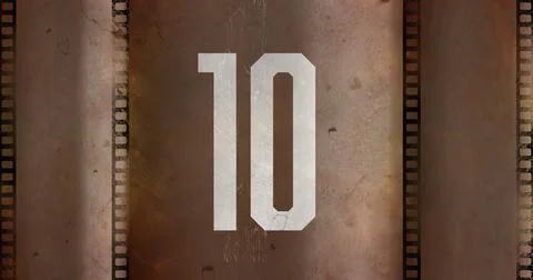 Composite of white number 10 text over old grudged film negative, copy space Stock Illustration