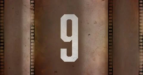 Composite of white number 9 text over old grudged film negative, copy space Stock Illustration