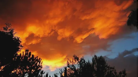 Composited sky on fire sunset timelapse under-lit clouds artwork Stock Footage 37093969