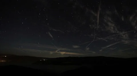 Composited Time lapse star trails and high clouds over castaic lake Stock Footage 35847047