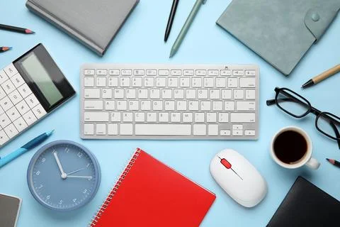 Composition with alarm clock, cup of coffee, computer keyboard and mouse on b Stock Photos