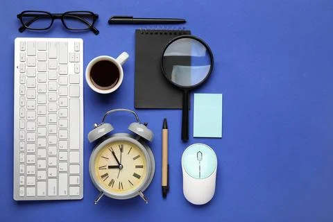 Composition with alarm clock, cup of coffee, computer keyboard and mouse on b Stock Photos