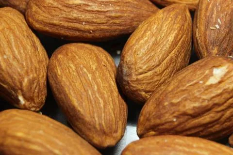 Composition from almond nuts background - macro photograph of almond nuts Stock Photos