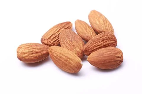 Composition from almond nuts isolated on white background Stock Photos