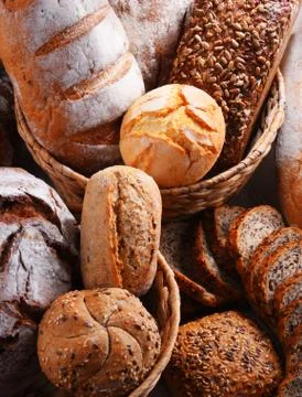 Composition with assorted bakery products in wicker basket Stock Photos