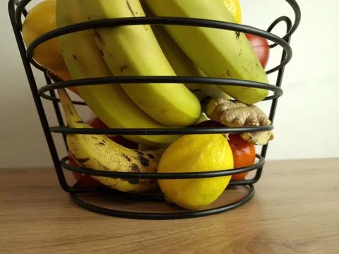 Composition with assorted fruits in basket on table Stock Photos