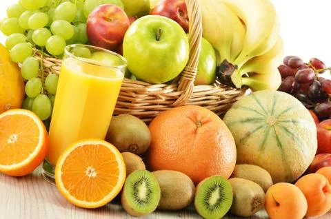 Composition with assorted fruits in wicker basket Stock Photos
