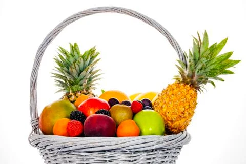 Composition with assorted fruits in wicker basket Stock Photos