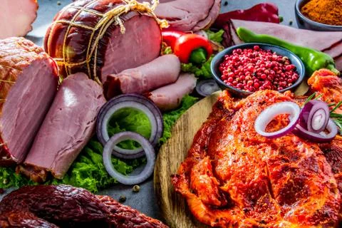 Composition with assorted meat products including ham, sausage and chuck stea Stock Photos