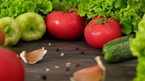 Composition with assorted raw organic vegetables on a dark background. Stock Footage 154242066