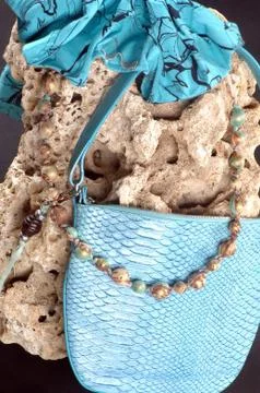 Composition with a bag, stone and beads Foto stock