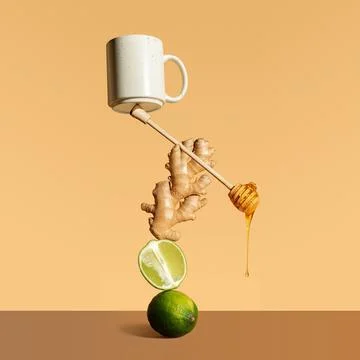Composition with balancing lime, ginger, tea and honey spoon. Minimalistic po Stock Photos