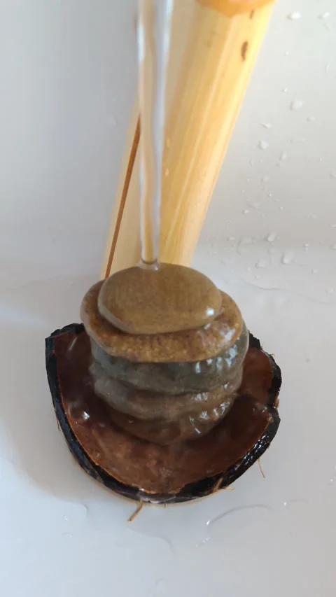 Composition of bamboo and stones with flowing water Stock Footage 315697093
