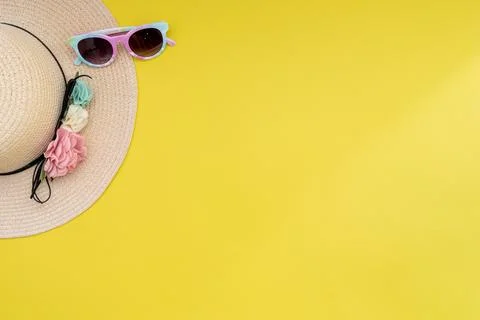 Composition with beach accessories and space for text on yellow background. Stock Photos