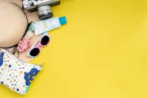 Composition with beach accessories and space for text on yellow background. Stock Photos