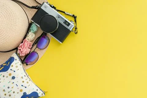 Composition with beach accessories and space for text on yellow background. Stock-Fotos