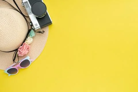 Composition with beach accessories and space for text on yellow background. Stock Photos