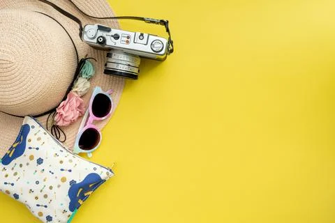 Composition with beach accessories and space for text on yellow background. Stock Photos