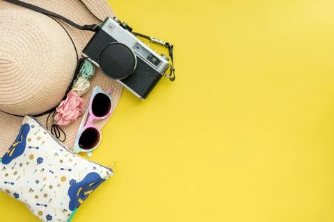 Composition with beach accessories and space for text on yellow background. Stock Photos