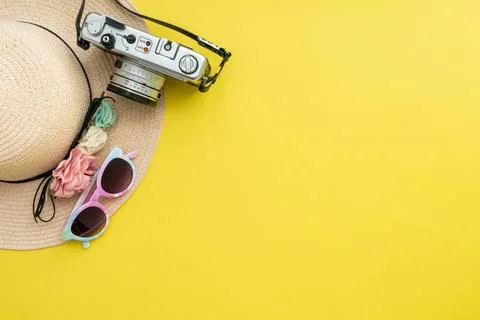 Composition with beach accessories and space for text on yellow background. Stock Photos
