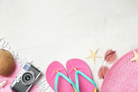 Composition with beach accessories and space for text on sand, flat lay Stock-Fotos