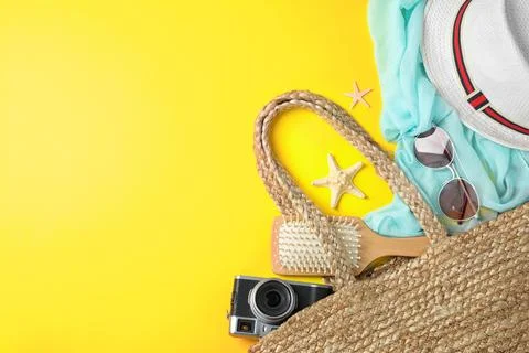 Composition with beach accessories and space for text on yellow background, f Stock-Fotos