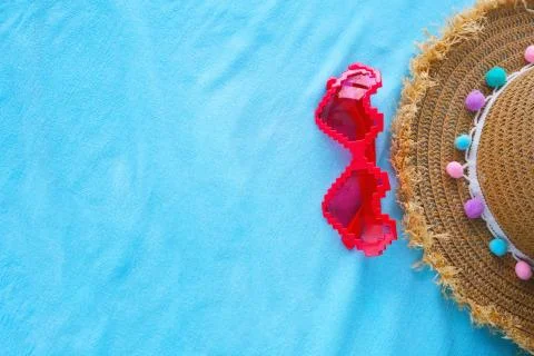 Composition with beach accessories on a blue background,space for text. Stock-Fotos