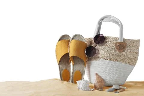 Composition with beach objects on sand against white background, space for te Stock Photos