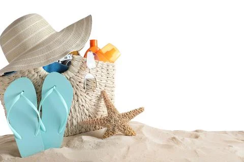Composition with beach objects on sand against white background, space for te Fotos de archivo