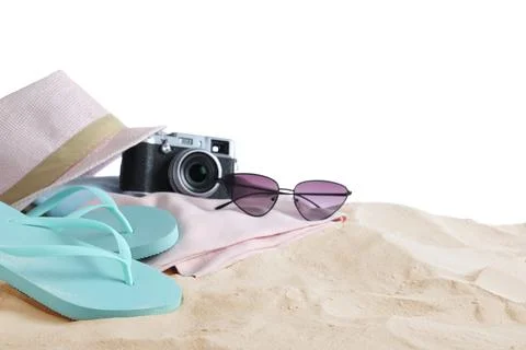 Composition with beach objects on sand against white background. Space for te Stock Photos