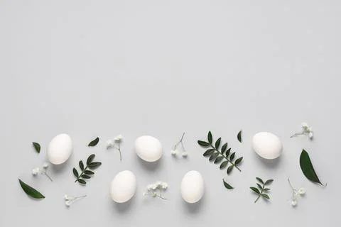 Composition with beautiful Easter eggs, gypsophila flowers and green twigs is Stock Photos