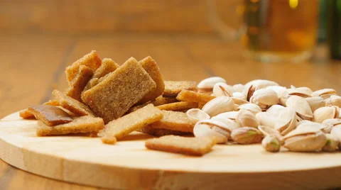 The composition of beer, crackers, pistachios, dried fish (No 3.4, LR Pan) Stock Footage 67300448