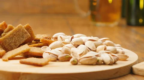 The composition of beer, crackers, pistachios, dried fish (No 3.5, RL Pan) Stock Footage 67300514