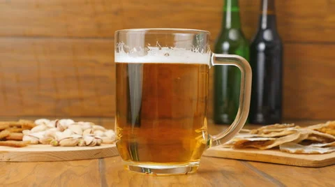 The composition of beer, crackers, pistachios, dried fish (No 3.7) Stock Footage 67300822