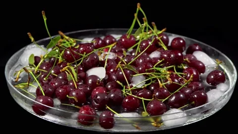 Composition of berries on a rotating table, cherry with ice Stock Footage 158580228
