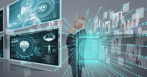Composition of binary coding over businessman looking at screen with medical Stock Photos