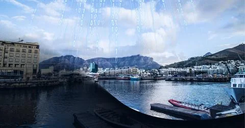 Composition of binary coding over cityscape in background 库存照片