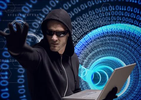 Composition of binary coding over hacker in hood using laptop Foto stock