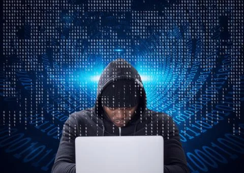 Composition of binary coding over hacker in hood using laptop Stock Photos