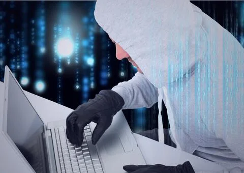 Composition of binary coding over hacker in hood and gloves using laptop Stock Photos