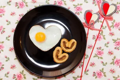 Composition of biscuits and egg in heart shape. Valentine's Day Stock Photos
