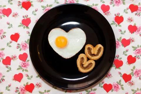 Composition of biscuits and egg in heart shape. Valentine's Day Stock Photos