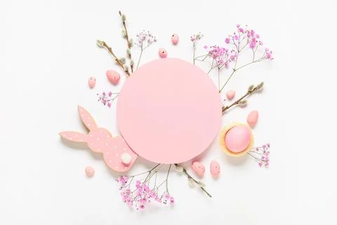Composition with blank card, Easter eggs, flowers and pussy willow branches o Stock Photos