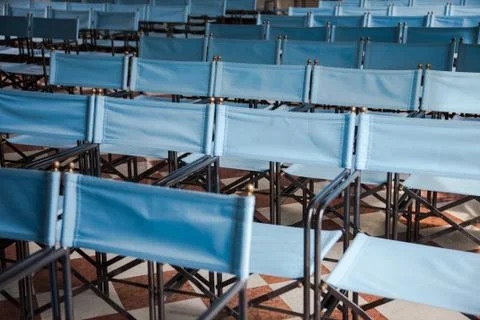 Composition of blue canvas folding chairs Stock Photos