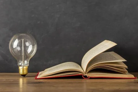Composition with book light bulb. High quality photo Stock Photos