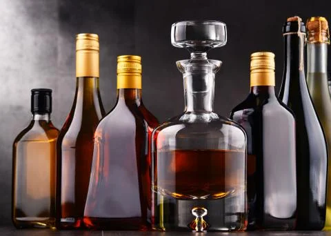 Composition with bottles of assorted alcoholic beverages. Stock Photos