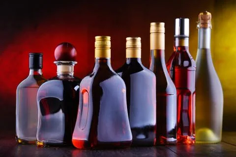Composition with bottles of assorted alcoholic beverages. Stock Photos