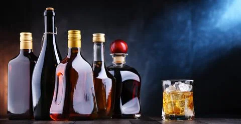 Composition with bottles of assorted alcoholic beverages. Foto stock